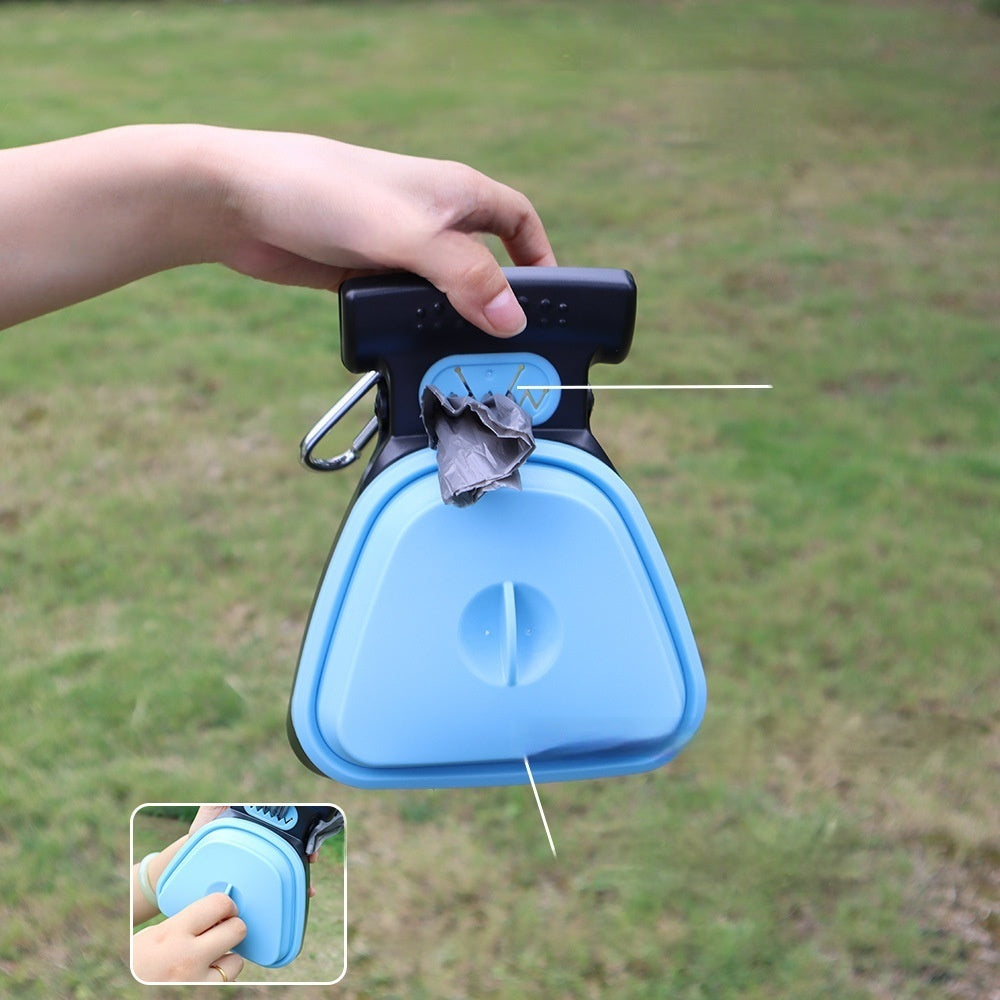 Poop scooper in use