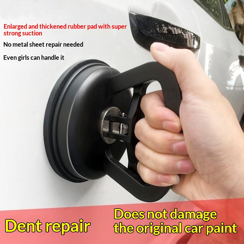 Suction cup dent puller held on a car